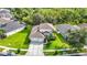 Charming two-story home with a well-manicured lawn and mature landscaping at 2256 Pantucket Dr, Wesley Chapel, FL 33543