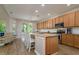 Modern kitchen with wooden cabinets, granite countertops, and stainless appliances at 2256 Pantucket Dr, Wesley Chapel, FL 33543