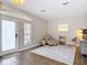 Bright living room features wood-look floors, a chandelier, and lots of natural light at 2256 Pantucket Dr, Wesley Chapel, FL 33543