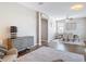 Open-concept living room features hardwood floors, modern sideboard, and a spacious dining area at 2256 Pantucket Dr, Wesley Chapel, FL 33543