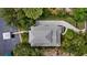 Aerial view of roof with a stone driveway and a dock on the water at 2314 N Riverside Dr, Tampa, FL 33602