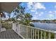 Enjoy the picturesque water view from this lovely balcony featuring white railings and a treed skyline at 2314 N Riverside Dr, Tampa, FL 33602