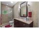 Stylish bathroom features a walk-in shower, granite vanity, and elegant wallpaper at 2314 N Riverside Dr, Tampa, FL 33602