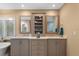 Bathroom with double sinks, custom cabinetry and marble countertops at 2314 N Riverside Dr, Tampa, FL 33602