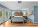 Primary bedroom with a king bed, hardwood floors, and French doors to balcony at 2314 N Riverside Dr, Tampa, FL 33602