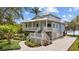 Charming two-story coastal home with a welcoming front porch and beautifully landscaped garden at 2314 N Riverside Dr, Tampa, FL 33602