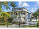 Lovely two-story home with porch and a fenced yard, perfect for enjoying the serene surroundings at 2314 N Riverside Dr, Tampa, FL 33602