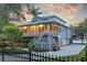 Beautiful two-story home with a charming porch and a well-manicured lawn, perfect for waterfront living at 2314 N Riverside Dr, Tampa, FL 33602