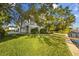 A lush lawn and meticulous landscaping surround this waterfront home with ample outdoor space at 2314 N Riverside Dr, Tampa, FL 33602
