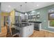 Stylish eat-in kitchen with modern appliances, granite counters, and bright natural light at 2314 N Riverside Dr, Tampa, FL 33602