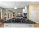Kitchen island with cooktop, granite countertops and view to the Gathering room at 2314 N Riverside Dr, Tampa, FL 33602