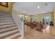 Spacious living room featuring hardwood floors, water views, and staircase at 2314 N Riverside Dr, Tampa, FL 33602