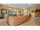 Spacious living room featuring hardwood floors, a large sofa, and neutral walls at 2314 N Riverside Dr, Tampa, FL 33602