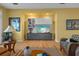 Living room featuring custom shelves, hardwood floors, and stylish decor at 2314 N Riverside Dr, Tampa, FL 33602