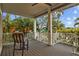 This delightful outdoor patio offers a great place to unwind with a chair and table overlooking lush foliage at 2314 N Riverside Dr, Tampa, FL 33602
