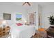 Bright bedroom with hardwood floors and ensuite bathroom at 2421 Brevard Ne Rd, St Petersburg, FL 33704