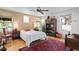 Bedroom with hardwood floors, bright windows, and rustic decor at 2421 Brevard Ne Rd, St Petersburg, FL 33704