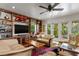 Bright living room with built-in shelving and large windows, creating an inviting space at 2421 Brevard Ne Rd, St Petersburg, FL 33704
