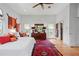 Spacious main bedroom with hardwood floors, decorative rug, and walk-in closet at 2421 Brevard Ne Rd, St Petersburg, FL 33704