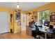 Bright home office with hardwood floors, large window, and custom decor at 2421 Brevard Ne Rd, St Petersburg, FL 33704