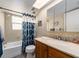 Clean bathroom features wood vanity with sink, tub with shower, and good lighting at 2555 Royal Pines Cir # A, Clearwater, FL 33763