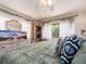 Well-lit bedroom showcases natural light, and a decorative dresser with mirror at 2555 Royal Pines Cir # A, Clearwater, FL 33763