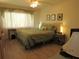 Cozy bedroom with a soft color palette, matching lamps, and a serene atmosphere at 2555 Royal Pines Cir # A, Clearwater, FL 33763