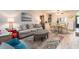 Bright living room featuring comfortable seating, area rug, and open floorplan at 2555 Royal Pines Cir # A, Clearwater, FL 33763