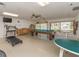 Recreation room with a billiard table, treadmill, weight bench, tables and chairs at 2555 Royal Pines Cir # A, Clearwater, FL 33763