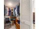 Walk-in closet with organized shelving, plenty of storage space, and ample room for clothing at 2555 Royal Pines Cir # A, Clearwater, FL 33763