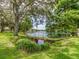 Scenic water view from the property, featuring lush landscaping and a tranquil lake backdrop at 2555 Royal Pines Cir # A, Clearwater, FL 33763