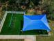 Aerial view shows a shaded playground with swings and green space, perfect for outdoor activities at 2629 Timacqua Dr, Holiday, FL 34691