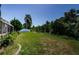 Expansive backyard with lush lawn, privacy foliage, and room to add custom landscaping at 2629 Timacqua Dr, Holiday, FL 34691