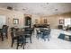 Spacious Key Vista Clubhouse with tables, chairs, sofas, and multiple ceiling fans at 2629 Timacqua Dr, Holiday, FL 34691
