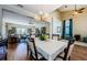 Open concept dining room and living room featuring hardwood floors and lots of natural light at 2629 Timacqua Dr, Holiday, FL 34691