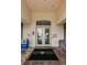 Key Vista Clubhouse entrance with double doors, stone flooring, and signs at 2629 Timacqua Dr, Holiday, FL 34691