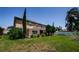 Spacious backyard with a screened-in porch area provides private outdoor living at 2629 Timacqua Dr, Holiday, FL 34691