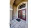 Stylish front door with tiled entryway and decorative accents at 2629 Timacqua Dr, Holiday, FL 34691