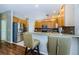 Well-lit kitchen boasts stainless steel appliances and breakfast bar with seating at 2629 Timacqua Dr, Holiday, FL 34691