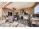 Outdoor living space with screened lanai featuring dining area and built-in kitchen at 2629 Timacqua Dr, Holiday, FL 34691