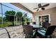 Cozy screened lanai with outdoor seating is ideal for entertaining and relaxation at 2629 Timacqua Dr, Holiday, FL 34691