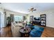 Comfortable living room with modern decor, large windows, and hardwood floors at 2629 Timacqua Dr, Holiday, FL 34691