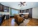 Office featuring custom built-in shelving, hardwood floors, and natural light, creating a comfortable workspace at 2629 Timacqua Dr, Holiday, FL 34691