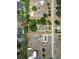 Aerial view showcasing property lines and surroundings in a residential neighborhood with lush trees at 2805 Olavet Ct, Valrico, FL 33596