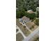 Spacious property featuring a cozy home, outbuilding, mature trees, and defined property lines at 2805 Olavet Ct, Valrico, FL 33596