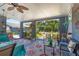 Spacious, covered back patio with a ceiling fan, outdoor seating, and a view of the backyard at 2805 Olavet Ct, Valrico, FL 33596