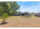 Well-manicured backyard featuring a patio area and a neatly maintained lawn at 2805 Olavet Ct, Valrico, FL 33596