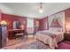 Bedroom featuring a bed, desk, and treadmill at 2805 Olavet Ct, Valrico, FL 33596