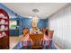 Bright dining room with stylish chandelier and seamless view to the kitchen and backyard, perfect for entertaining at 2805 Olavet Ct, Valrico, FL 33596