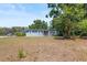Charming single-story home featuring a cozy front porch, well-shaded by mature trees and natural landscaping at 2805 Olavet Ct, Valrico, FL 33596